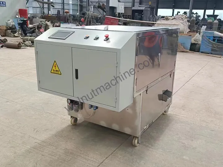 Automatic macadamia nut cracker